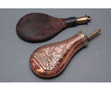 Copper and brass powder flask decorated with star and striped flag, cannon, etc., 20 cm, and a leather and brass shot flask, 