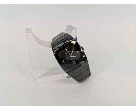 ARMBANDUHR / HERRENUHR - RADO, Modell "Jubilé", Quartz. Rado Watch Co. / Schweiz. Eckiges schwarzes Gehäuse an schwarzem Glie
