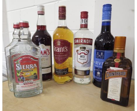 Seven bottles of spirits Grant's Triple Wood 1ltr, Sierra Tequila Silver x 2, Cointreau 50cl, Smirnoff Vodka 700ml, Harvey's 