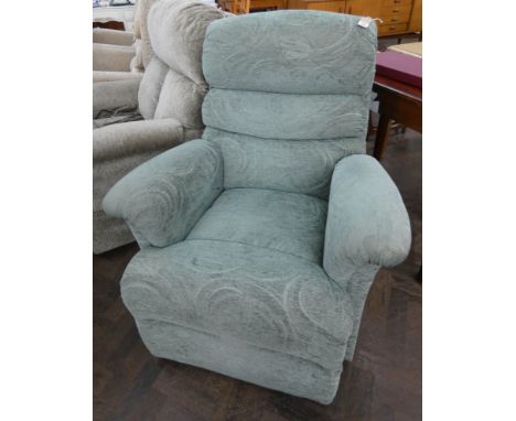 A manual recline easy chair in green covering  