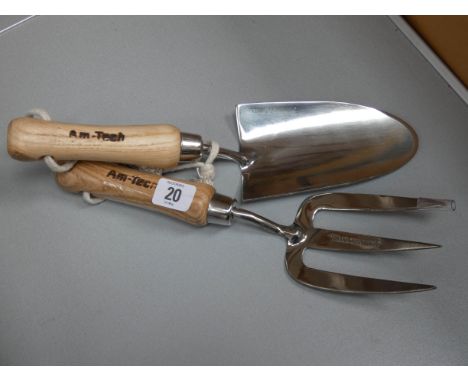 A stainless steel hand trowel and hand fork