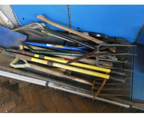 A large quantity of garden tools including post hole diggers etc 