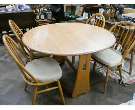 Ercol Golden Dawn drop leaf Sutherland style dining table and four hoop backed Ercol chairs   In very good condition 