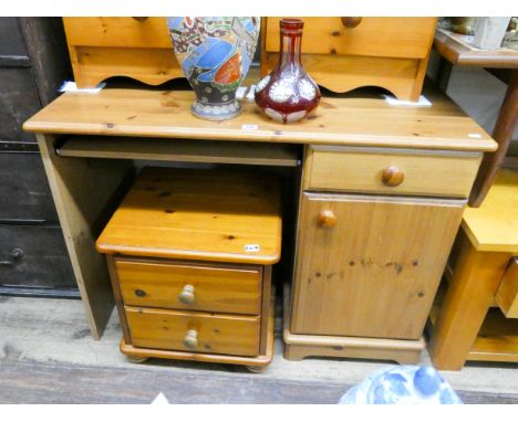 A varnished pine, single pedestal dressing table and a two door bedside cabinet 