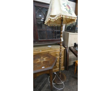 A bobbin turned oak standard lamp with shade (failed safety test)