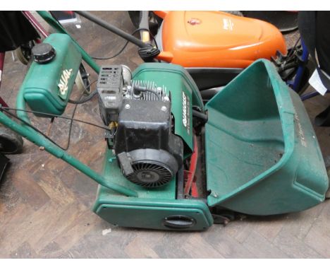 A Qualcast classic petrol 35 petrol engine cylinder lawn mower with heavy roller 