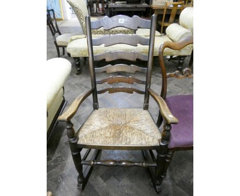 A Lancashire style ladder back rocking chair with rushed seat 