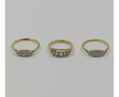 Three early 20th century diamond rings, two stamped '18CT and PLAT', with illusion set small eight-cut and rose cut diamonds,