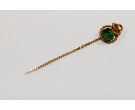 A simulated emerald paste set stick pin with entwined snake terminal, 6.5cm long, cased CONDITION REPORT: Please note - Descr