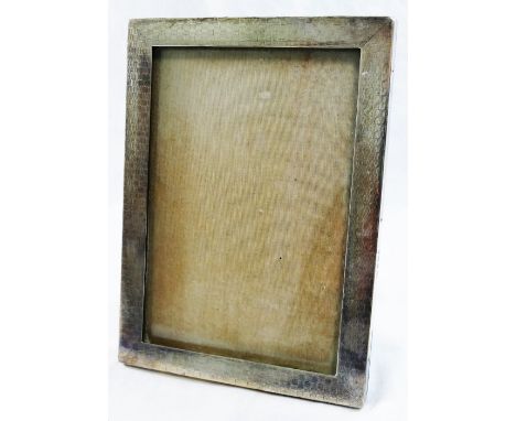 A George V rectangular silver photograph frame, Birmingham 1924, with engine turned decoration and wooden easel back, overall