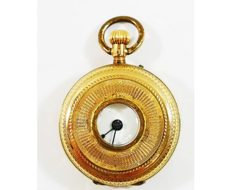 A ladies Continental half hunter pocket watch, the case with engine turned decoration and stamped '14K', the white enamel dia