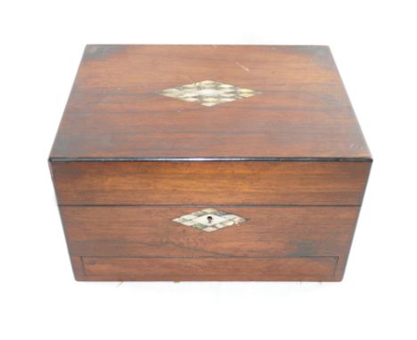 A Victorian rosewood toiletry box, the lid and escutcheon with inlaid mother of pearl and abalone decoration, the interior of