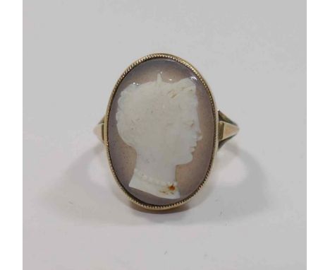A 19th century carved hardstone cameo ring, featuring the profile of the head of a woman, in open back rub-over setting, the 