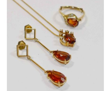 A matched suite of heat treated orange citrine and diamond jewellery set in yellow metal stamped '750', earrings, pendant and