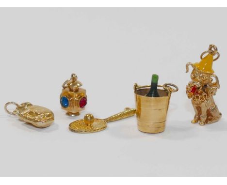 Five 9 carat gold charms, comprised of a lantern, tennis racket, koala, clown dog and champagne bottle in a bucket, 11.7g gro