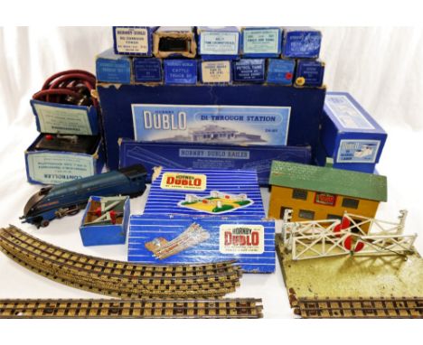 A collection of 1950's Hornby Dublo railway items, mostly boxed, including a locomotive 'Sir Nigel Gresley' and tender, a Bri