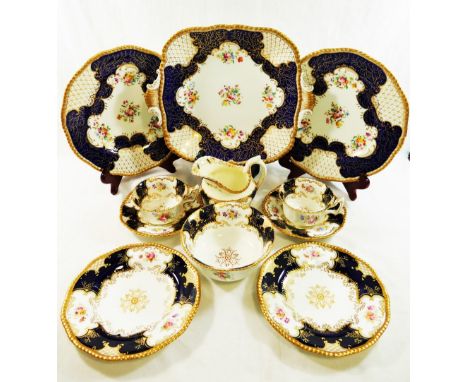 A Coalport batwing pattern part tea service, with cobalt blue panels, comprised of seven cups, nine saucers, six plates, a cr