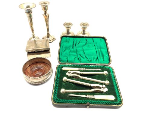 Victorian silver cigarette box, Elizabeth II silver coaster, Birmingham 1997, pair of silver dwarf candlesticks, silver taper