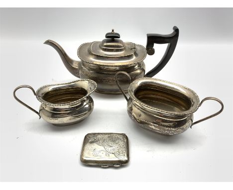 Silver three piece tea set with egg and dart border, the tea pot with ebonised handle and lift Sheffield 1931 Maker Viners an