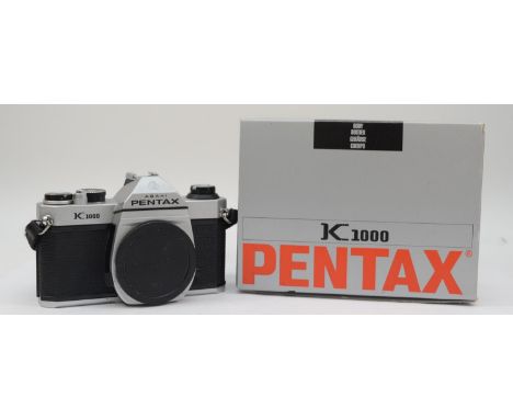 A Pentax K-1000 35mm film camera, body only, with original box and manual, working 