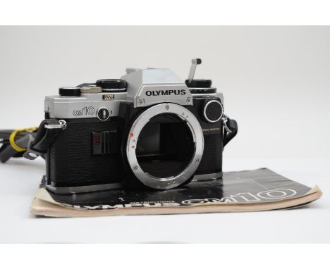 A Olympus OM10 35mm film camera, body only, with manual, working 