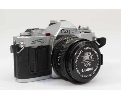 A Canon AV-1 35mm film camera, with a Canon 50mm f1.8 lens, working, lens may require a clean 