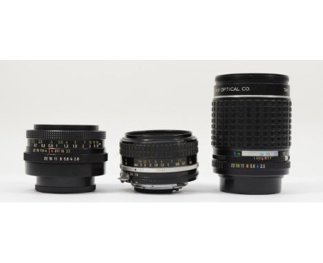 Three manual camera lenses, to include a Nikkor 50mm f1.8, a Tessar 50mm f2.8 and a Takumar 135mm f2.5, may require a strip c