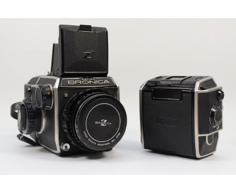 A Zenza Bronica medium format camera, with a Bronica 80mm f2.4 lens, waist level finder, manual winder and two 6x6 film backs