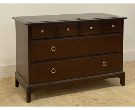 A vintage Stag Minstrel mahogany chest, fitted with four short and two long drawers, raised on bracket supports. H72cm, W107c