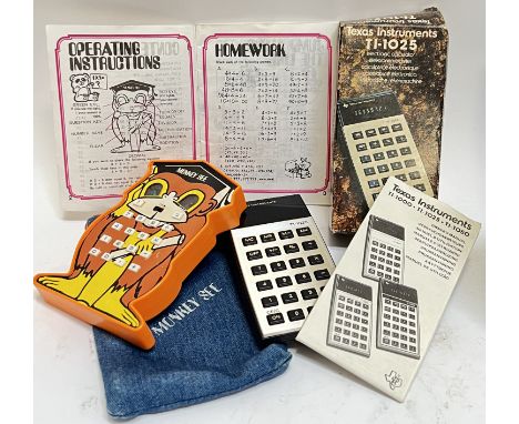 An unusual vintage 'Monkey See' calculator complete with original denim pouch and instruction/homework manual, together with 