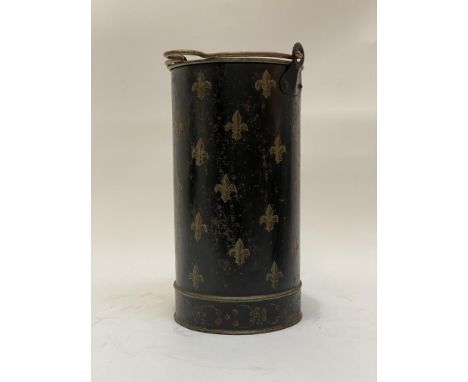 A vintage toleware stick stand / coal bucket of cylindrical form, with swing handle and decorated with fleur du lis motif. H3