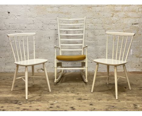 A pair of Danish mid century comb back chairs by Kendya, (H81cm) together with a mid century ladder back rocking chair. (H100