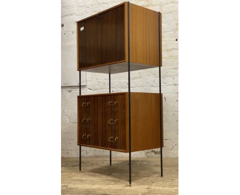 Vanson, a mid century teak / walnut modular free standing side cabinet, comprising a fall front cupboard with shelf, above th