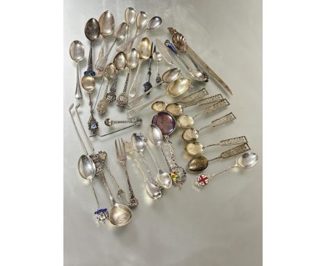 A collection of silver and white metal spoons to include a set of six Singapore handled tea spoons L x 12cm , fifteen various