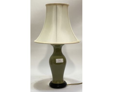 A ceramic table lamp of baluster form, in green celadon glaze. H54cm.&nbsp;