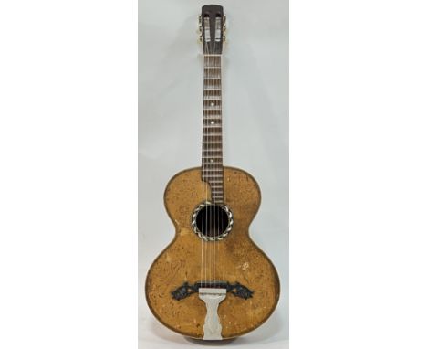 A vintage spruce and rosewood acoustic guitar, the tailpiece marked Dreima, the sound hole with geometric inlay and abalone, 