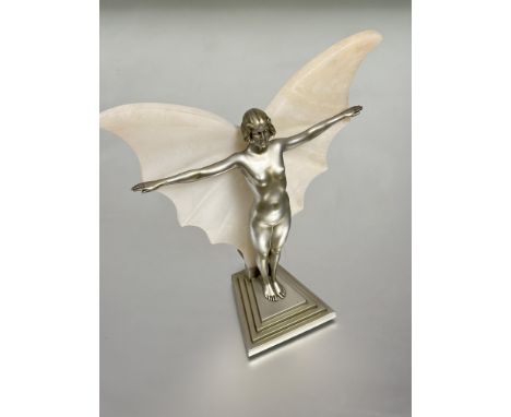 A 1930s Art Deco silver cast metal table lamp of a standing female butterfly figure with alabaster wings on raised on tapered