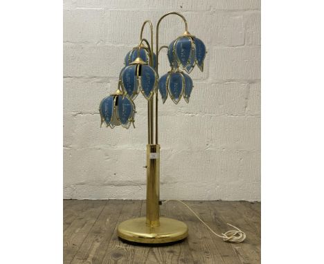 A Vintage brass floor lamp, four branches with coloured glass shades formed as lotus flowers. H105cm.&nbsp;