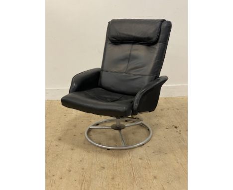 Ikea, a vintage 'Malung' reclining easy chair, upholstered in aniline black leather, raised on a tubular revolving base. H98c