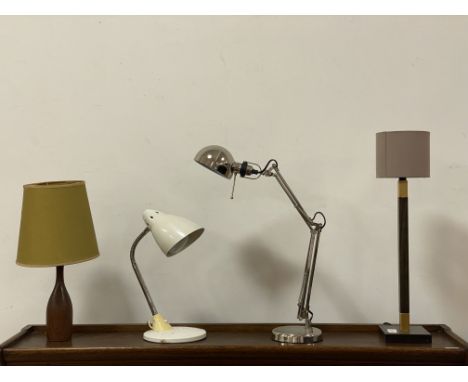A mid century teak mallet shaped table lamp and shade (H45cm) together with a 1970's articulated metal desk lamp (H45cm) an I