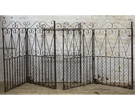 A pair of wrought iron bi-fold driveway gates decorated with scrolls (400cm width total, height 152cm) together with a matchi