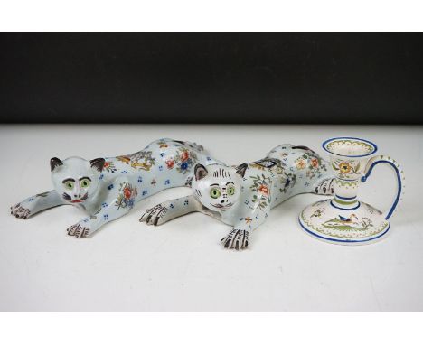 Two French Faience wall pockets modelled as outstretched cats, decorated with ' Amavie ' crests, painted floral sprays and gl