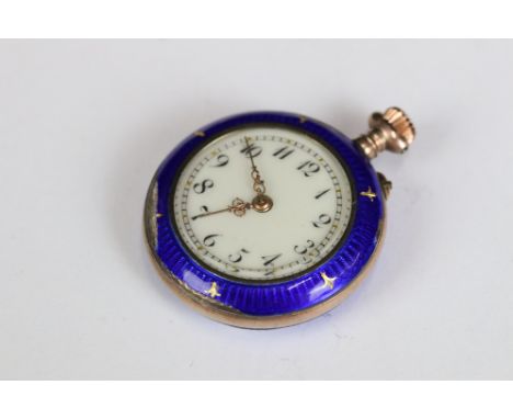 An antique ladies yellow metal fob watch with enamel and gilt decoration. 