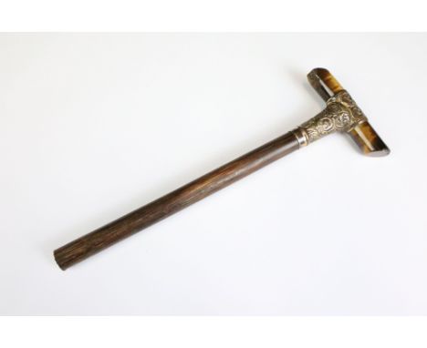 An antique parasol or walking stick handle, tigers eye cross handle with hallmarked 15ct gold mounting. 