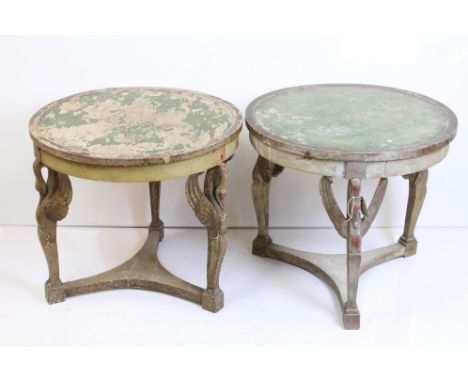 Pair of Distressed Painted Circular Lamp Tables in the Empire manner, each raised on three supports carved in the form of swa
