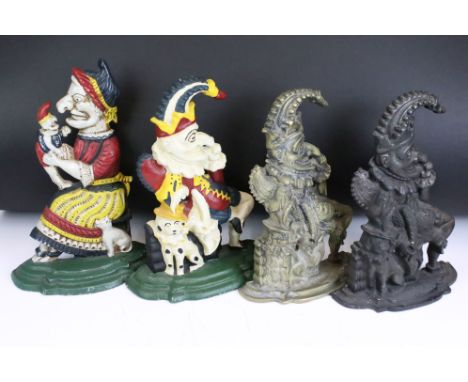 A collection of three Punch &amp; Judy cast iron door stops together with a brass example. 