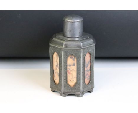 Chinese Shantou (Kut Hing) octagonal pewter tea caddy with eight panels (behind glass) with ornate frames. Seal mark on base.