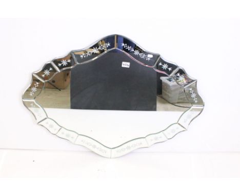 20th century Venetian style shaped Wall Mirror, the mirrored panel frame with bevelled edges and floral decoration, 100cm x 7