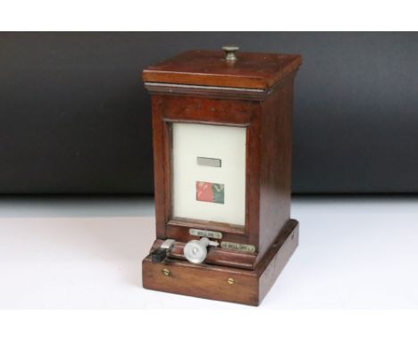 Railwayana - A Mid 20th C mahogany cased lamp repeater, with bell on/off switch. Measures approx 25cm high 