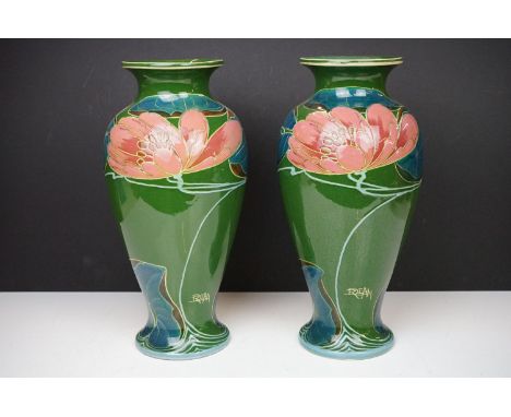 Pair of Phoenix Ware vases of inverted baluster, circa 1920's, with stylised floral decoration on green ground, signed R. Dea